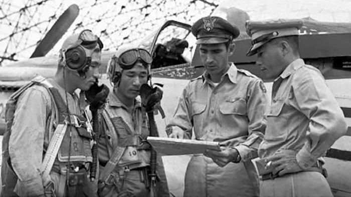 In this undated file photo provided by the Air Force, the late Col. Dean E. Hess (2nd from right), trains South Korean pilots during the Korean War.